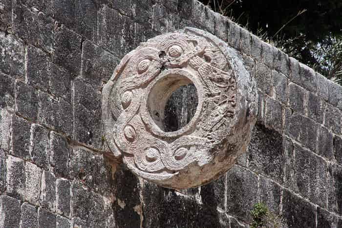 A stone hoop attached to a stone wall