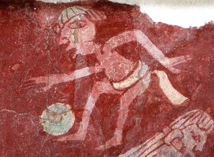 Mural painting showing a man playing soccer