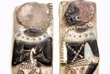 Ancient art piece. It pictures two black people wearing jewels.