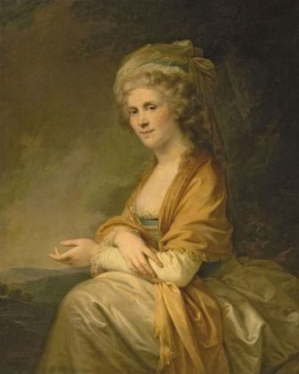 Another woman in an elegant silky gown. Hers is yellow and brown.
