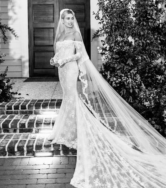Hailey in her lace wedding dress with a long veil.