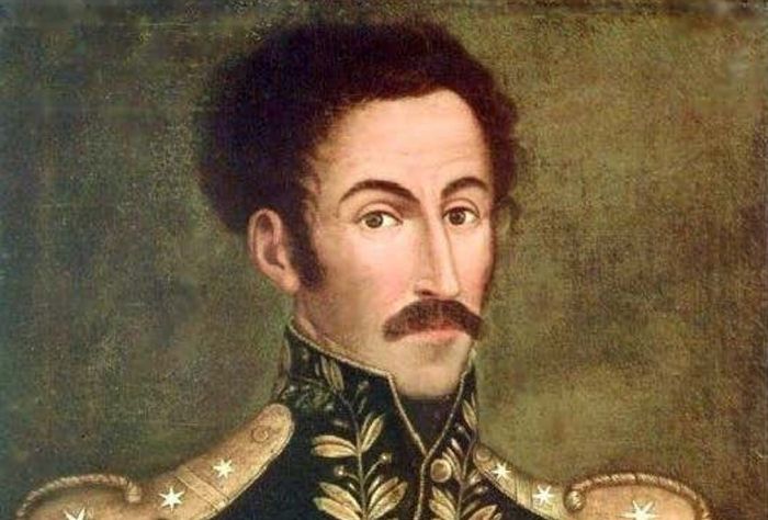 Portrait of Simon in military uniform. He has black curly hair, a long, thin face, a long prominent nose, and a mustache.