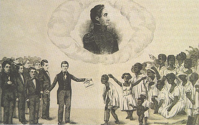 Engraving. A group of white, suited men stand on the left and one of them holds a paper that reads "freedom." On the right of the painting is a group of African people. Above both groups floats an image of Simon Bolivar.