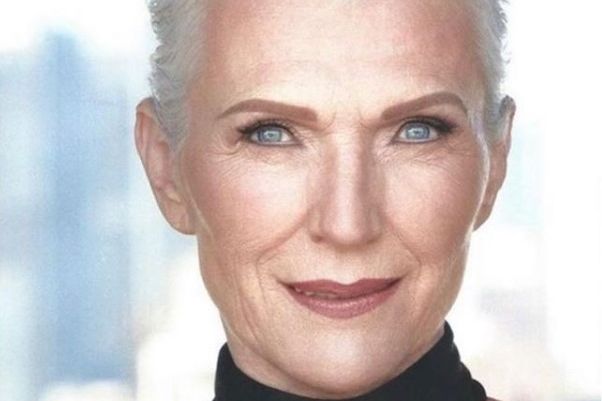 Close-up of a good-looking woman in her seventies. It is a fashion shot, she has white hair and impeccable make-up.