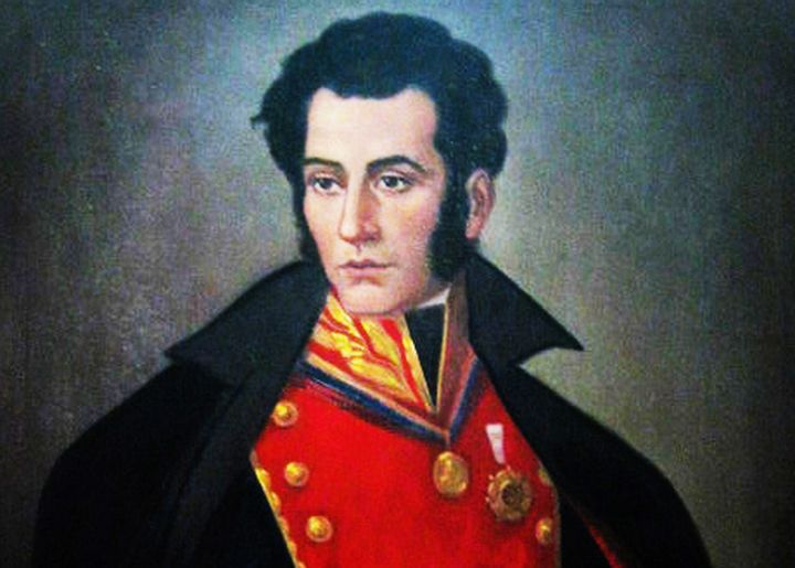 Portrait of Jose de Sucre. A man in his early thirties wearing a general's uniform. He looks away, his hair is black, he has big sideburns and pale skin.