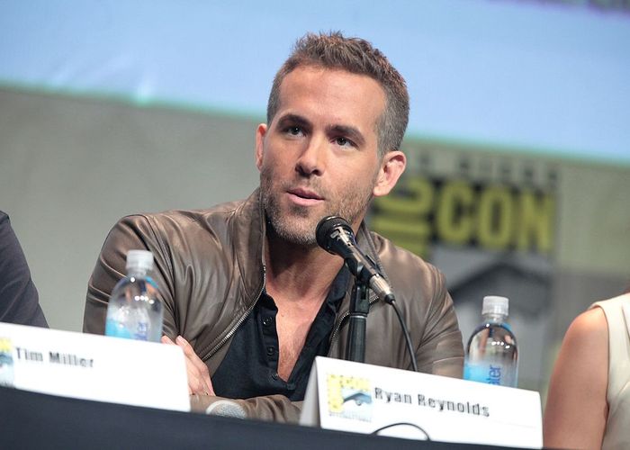 Picture of Ryan during a press conference. He is wearing a leather jacket.