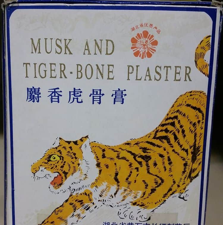 Another commercial product with an image of a tiger. It reads: Musk and tiger-bone plaster.
