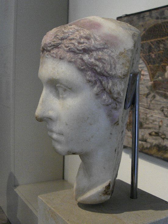 Marble bust. It portrays the same woman of the previous bust. This statue does have the nose. In this one, the woman seems a few years older.