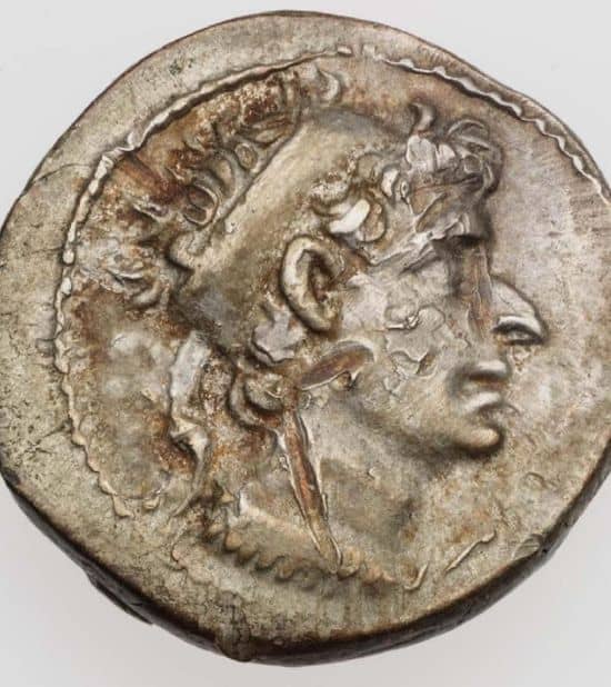Silver coin with the face of a man. He wears the diadem of a Greek king. He has an extremely aquiline nose, thin lips and a protruding chin.
