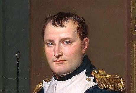 Painting of Napoleon posing inside his study in military uniform.